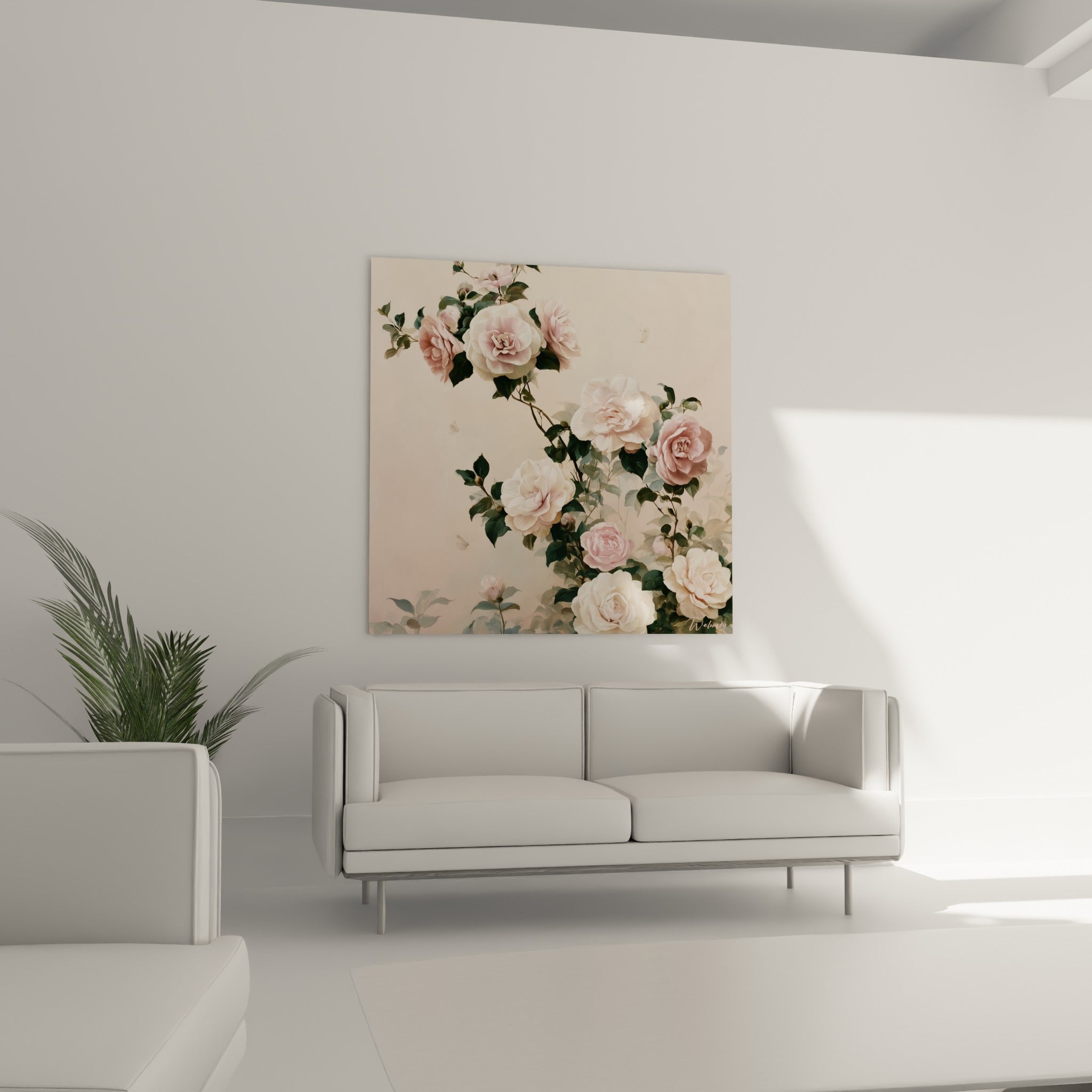 Fleurs de camélia rose poudré et blanc, suspendues au-dessus d'un canapé dans un salon lumineux