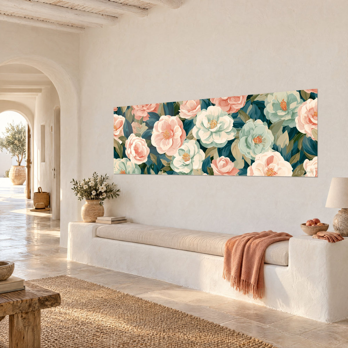 Tableau fleurs de camélia crème aux étamines orangées parmi des feuilles bleu nuit, vue de trois-quarts, banquette blanche et plaid corail