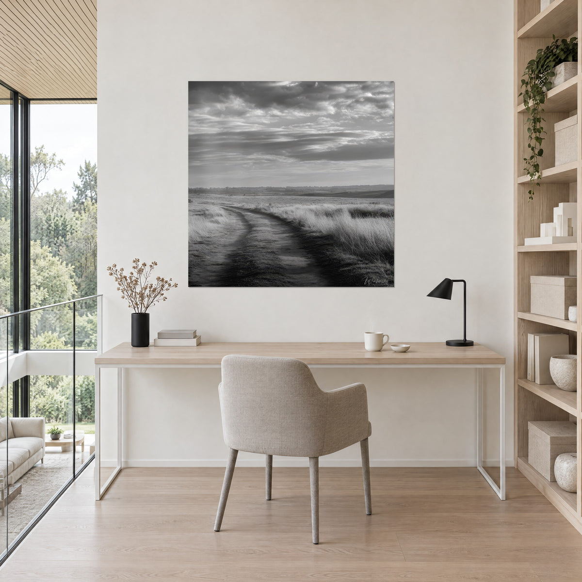 Wall art Monochrome country path with pale tufts of grass, slate grey and milky white, above a light wood desk