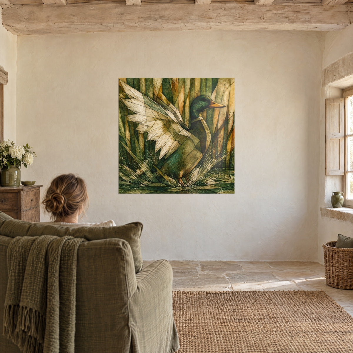 Wall art wild duck in flight, dark green head and vibrant sandy wings, ochre and green reeds, facing an olive green armchair