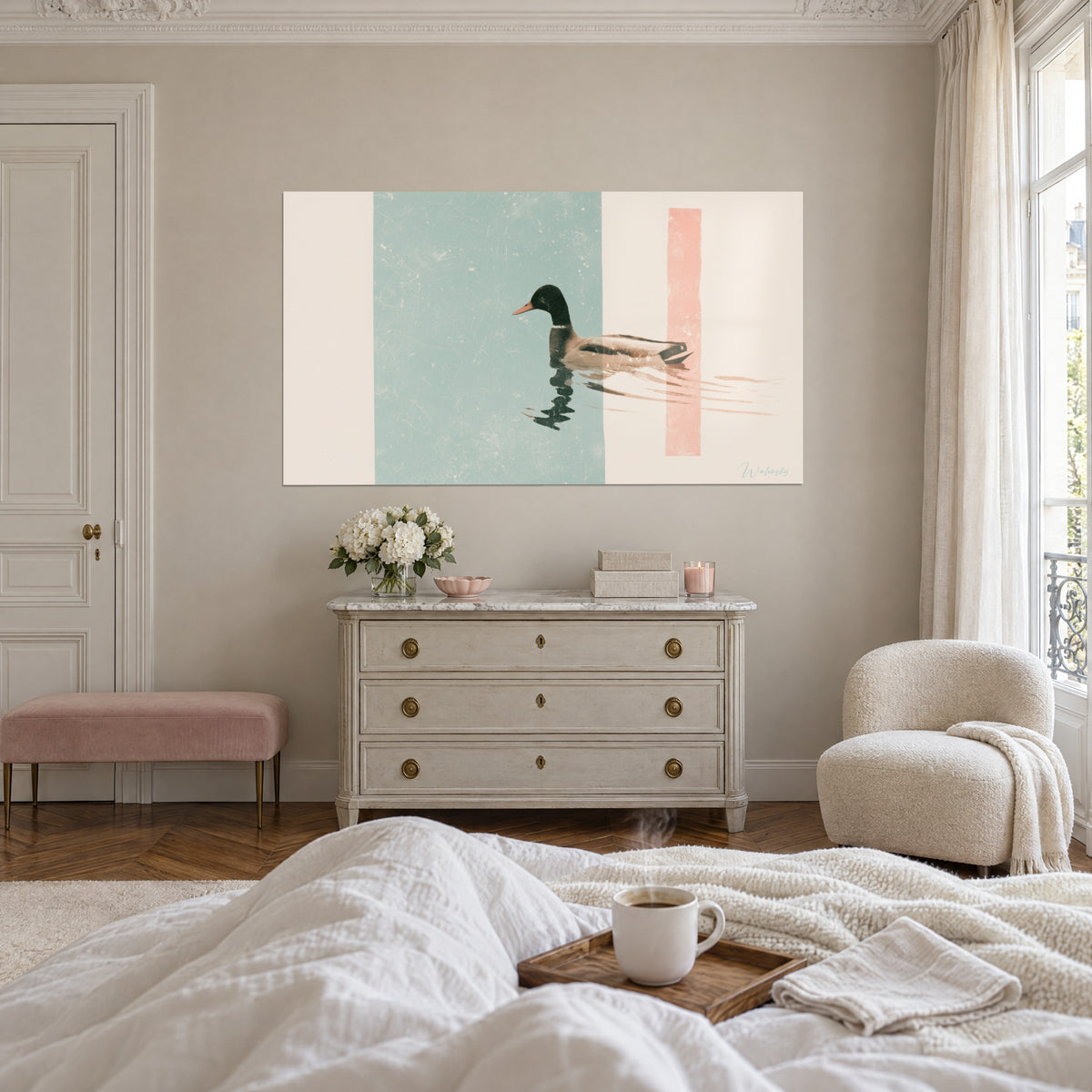 Wall art of a duck with an orange bill cutting through the water, sea-green block and coral stripe, above a bed in a light bedroom