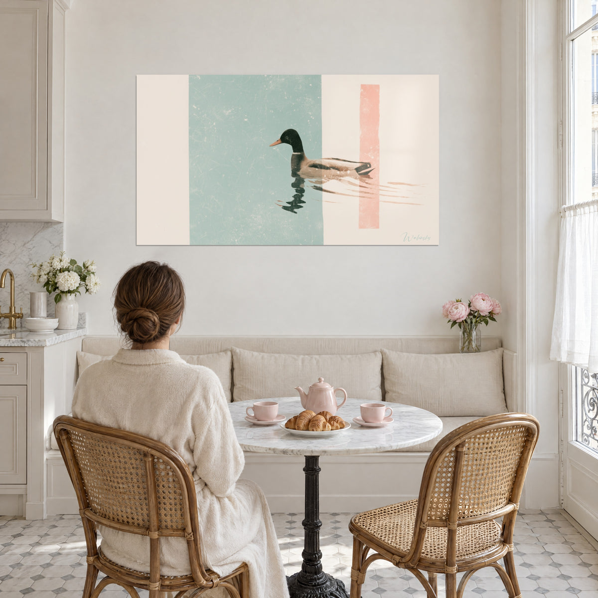 Wall art of a mallard with brown and cream plumage, pale pink wake on an ivory background, facing a round table with pink cups