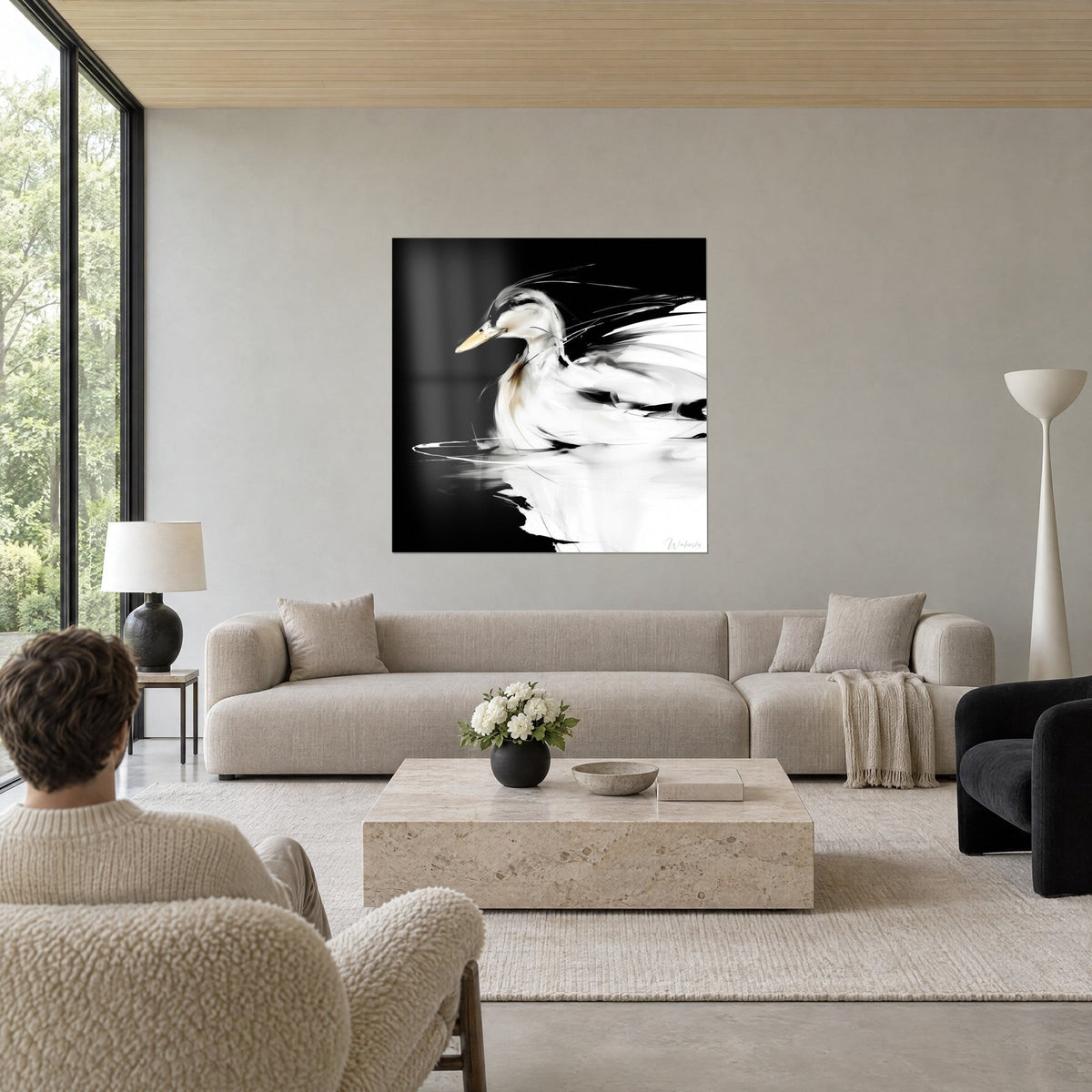 Tableau canard blanc nageant sur eau noire, bec ocre et plumage crème, au-dessus d'un canapé dans un salon lumineux