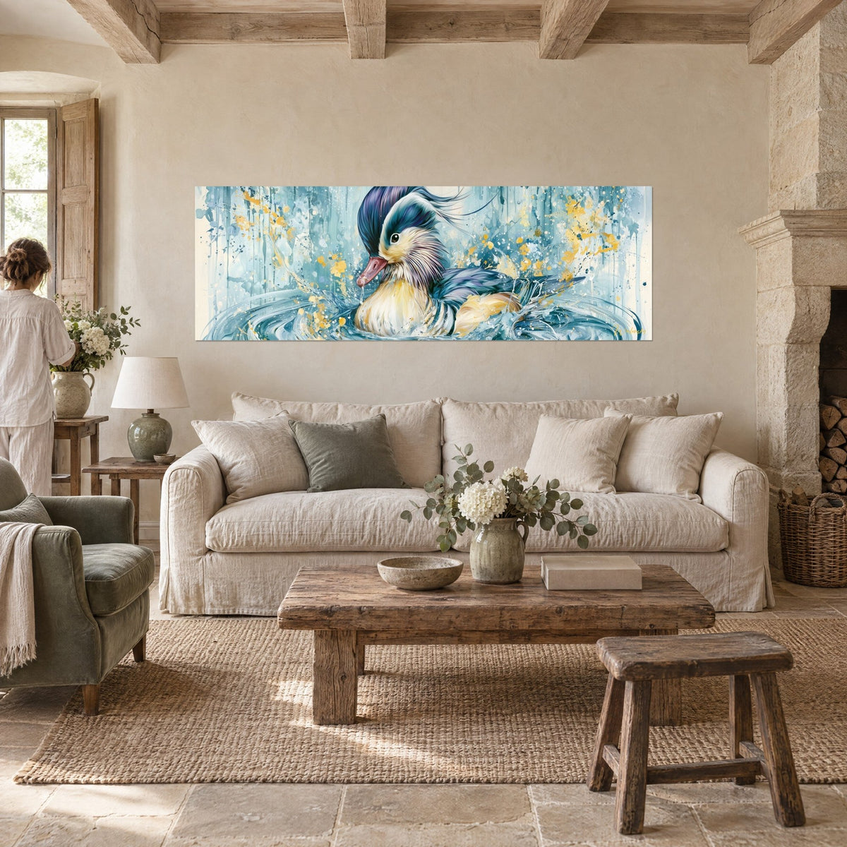 Wall art of a mandarin duck with an indigo crest floating on turquoise water splashed with gold, above a sofa in a bright living room