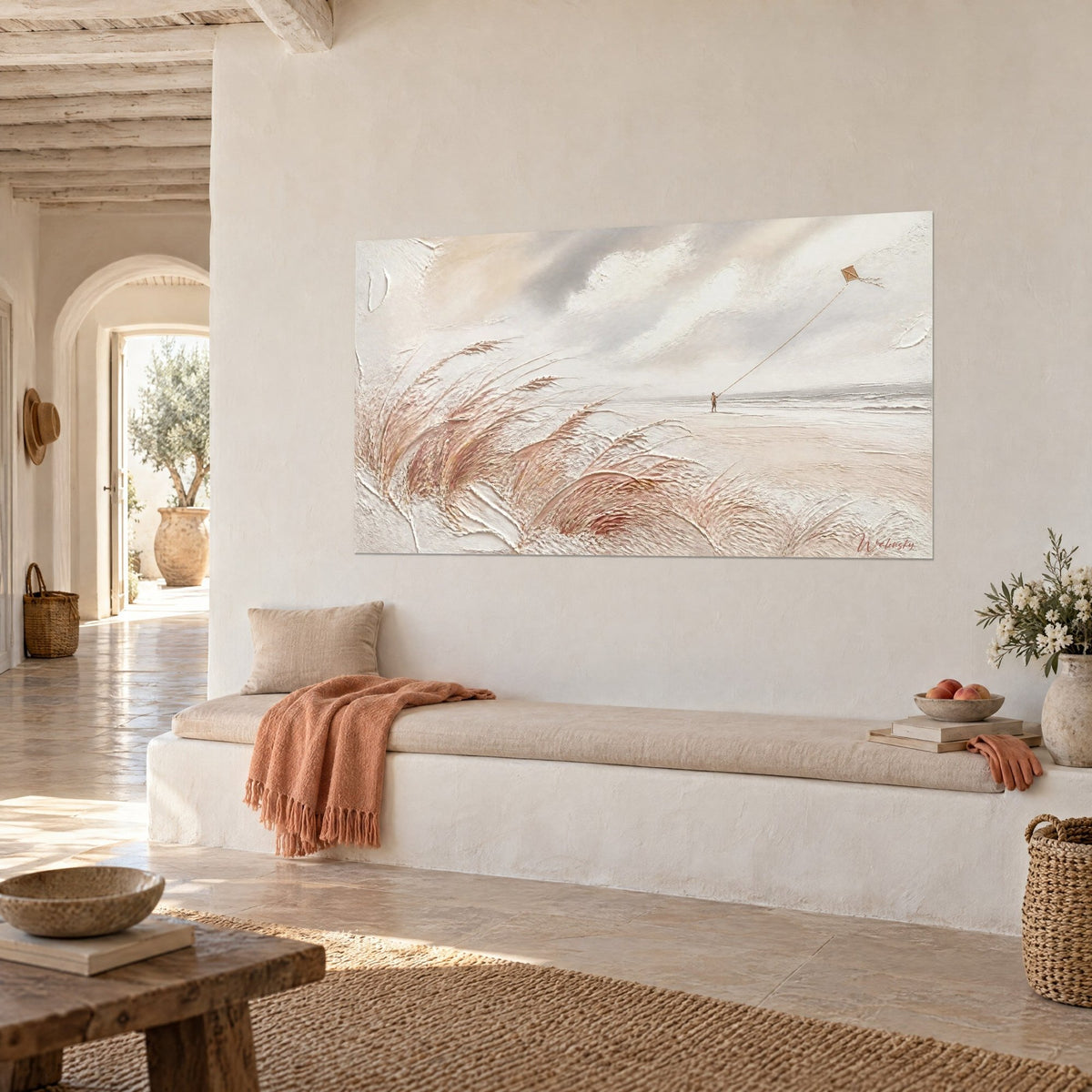 Wall art little boy and ochre kite under a cloudy sky, pink beach grass in relief, on a white wall of a Mediterranean house