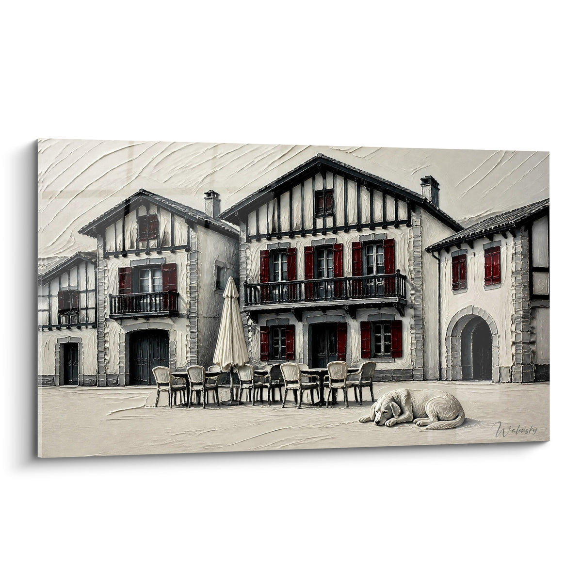Maisons basques aux volets rouge profond et pans de bois anthracite, façades beige texturées