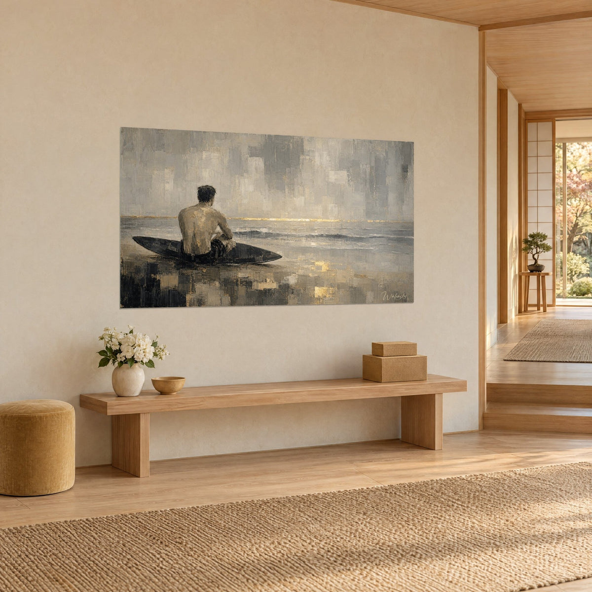 Wall art man seen from behind facing the ocean, black board, grey and beige sky, golden line on the horizon, cream wall of a japandi hallway