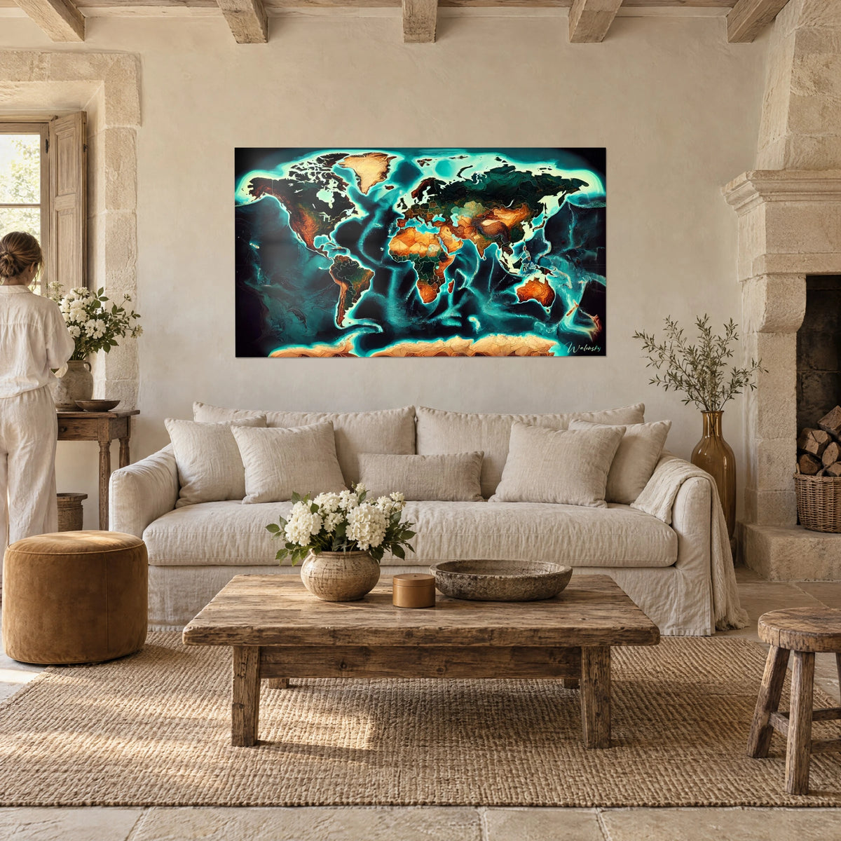 Wall art world map with ochre and copper continents outlined in bright turquoise, above a sofa in a sunny living room