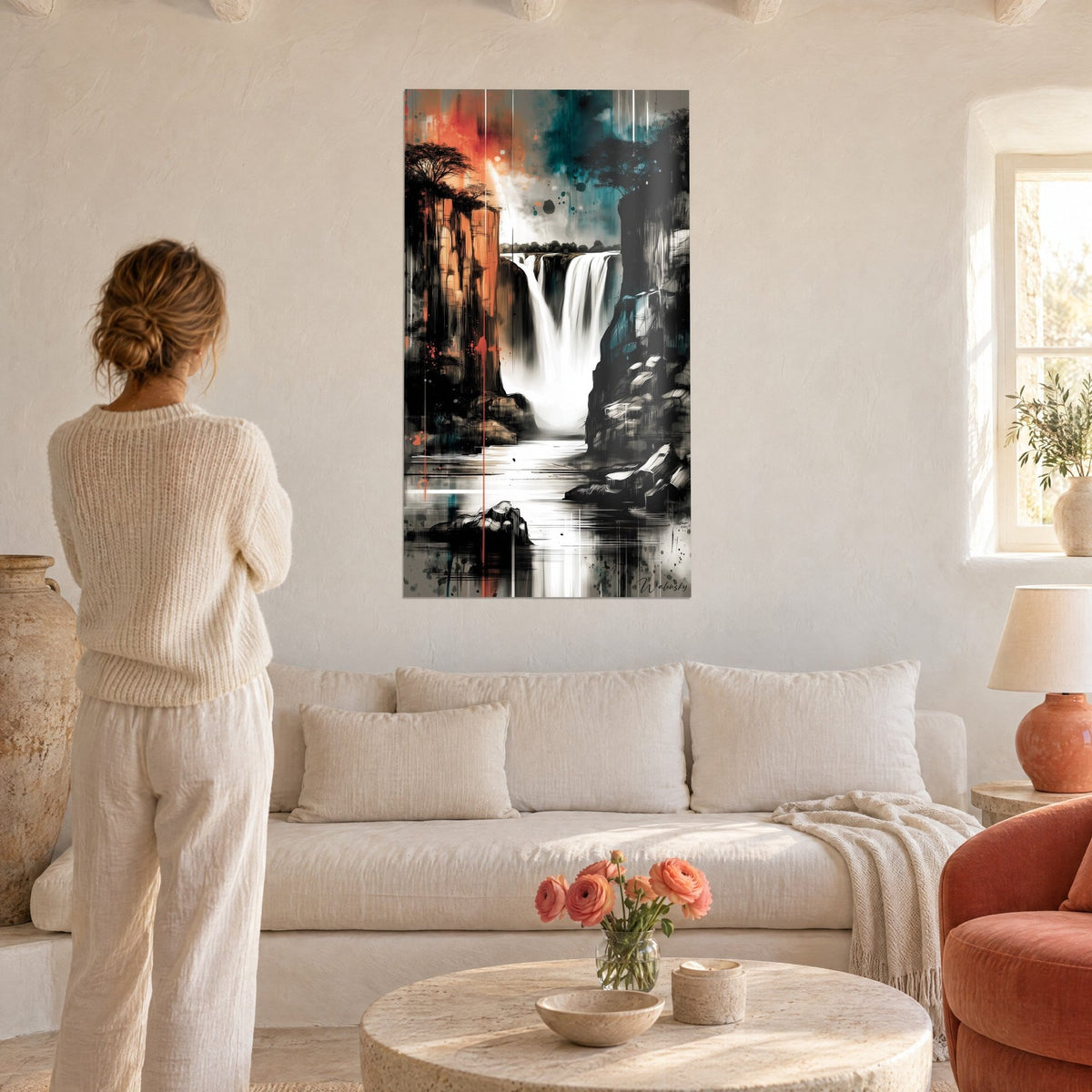 Wall art Tropical waterfall in black, white and orange, ink cliffs and acacia trees, woman seen from behind, above a sofa in a bright living room