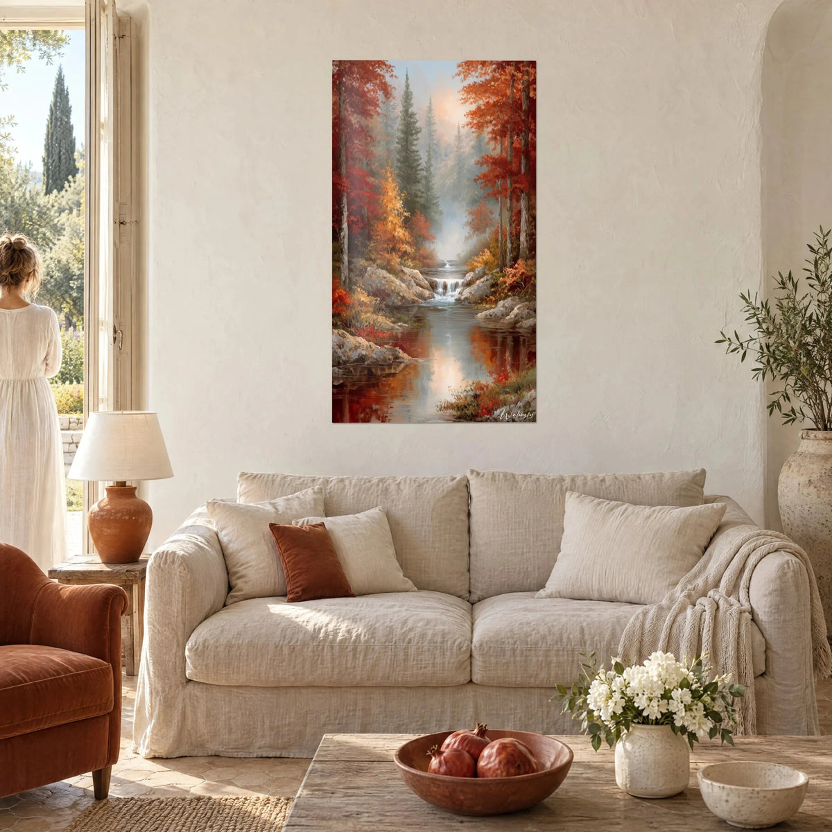 Wall art waterfall in an autumn forest, red and orange foliage, smooth river, woman seen from behind, above a sofa in a bright living room