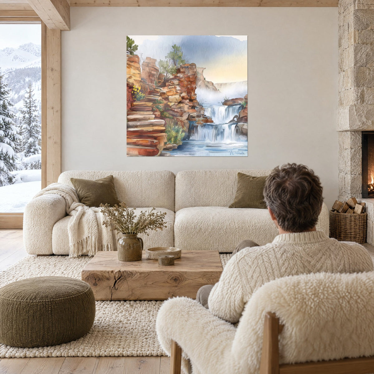 Wall art watercolor waterfall, orange rocks and bluish cascade in the mist, above a sofa in a bright living room