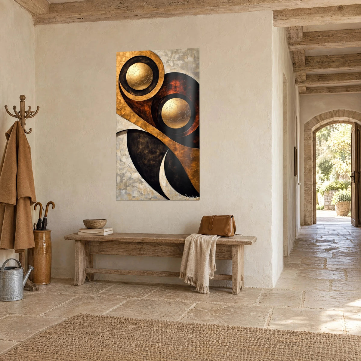 Abstract wall art of two cracked gold discs ringed in ebony, ivory crescent, in a stone hallway with an arched entrance