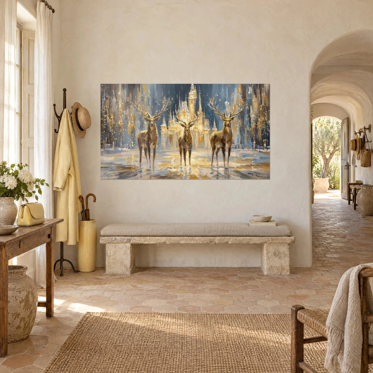 Wall art fairytale castle glowing gold behind three stags facing forward, steel blue and beige, white wall of a Provençal farmhouse