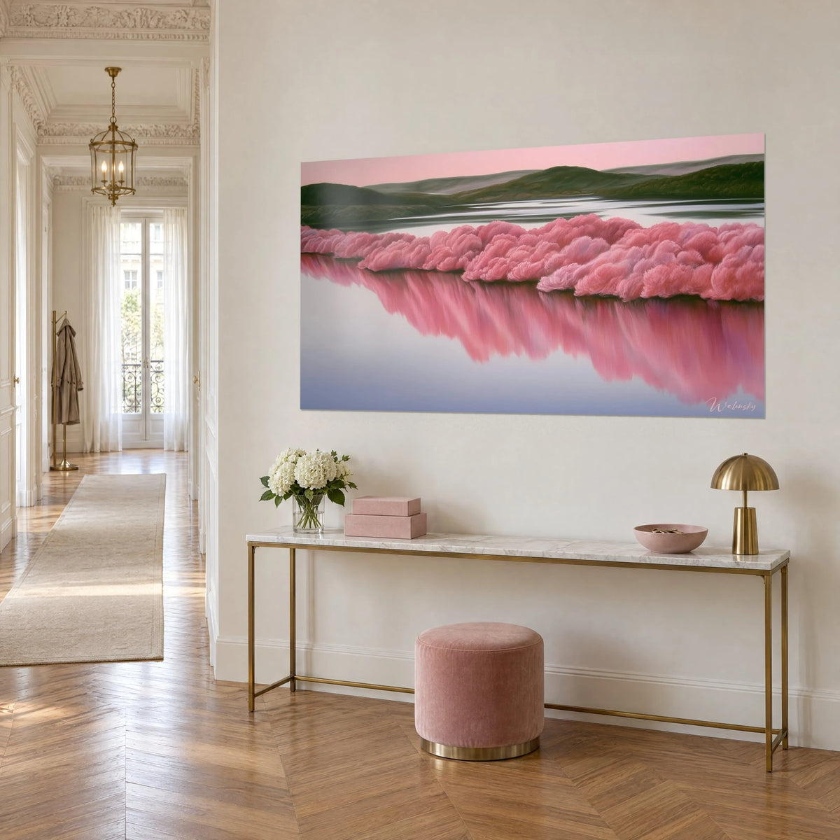 Wall art of a row of coral-pink cherry trees shimmering over lilac water and green hills, hung on a beige wall of a Haussmann-style corridor