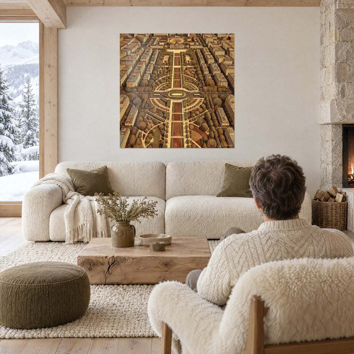 Wall art aerial view of a Parisian square, ochre and gold avenues, beige rooftops, man seen from behind above a sofa in a bright living room