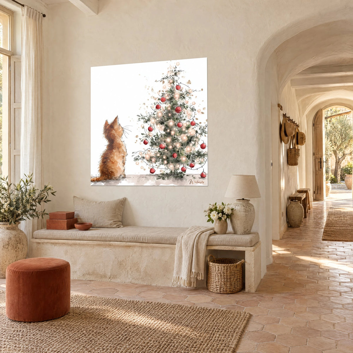 Wall art of a small orange kitten fascinated by a fir tree strung with amber lights and carmine baubles, in the vaulted hallway of the farmhouse