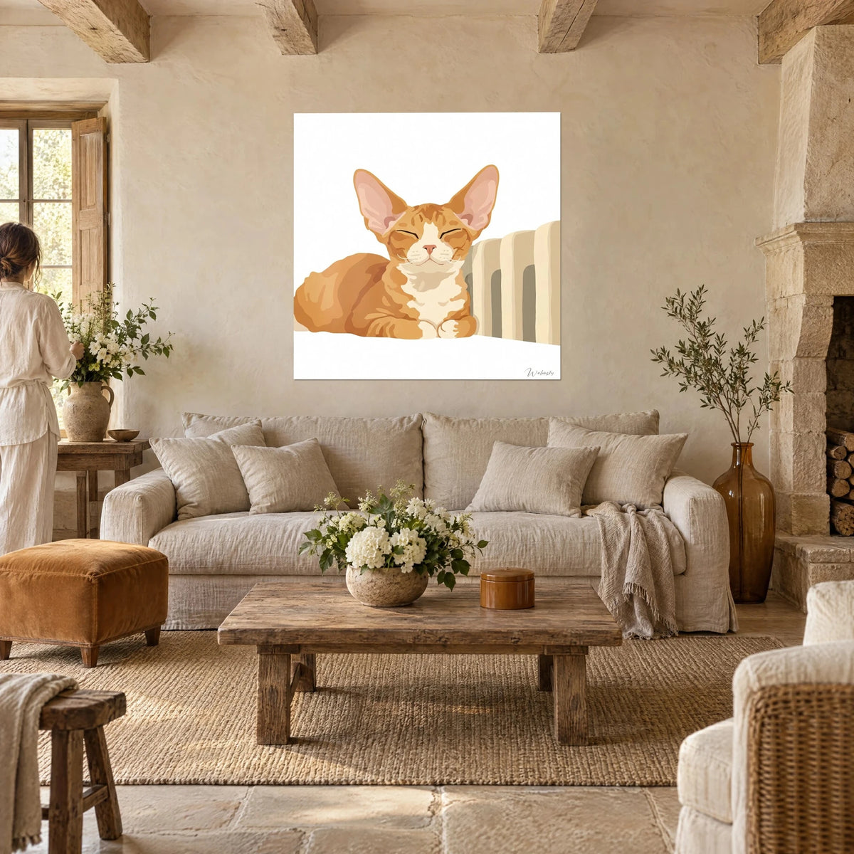 Wall art of a ginger cat with huge ears, orange coat and cream chest, eyes closed, above a sofa in a bright living room