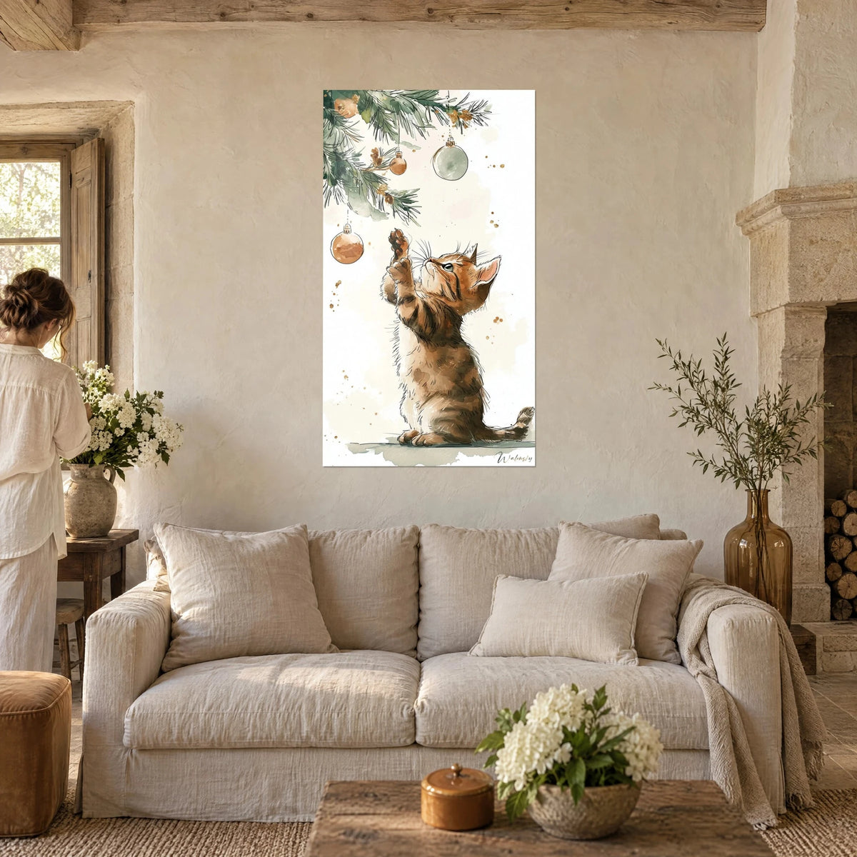 Wall art ginger kitten standing on its hind legs, sage green fir branch and copper baubles, above a sofa in a bright living room
