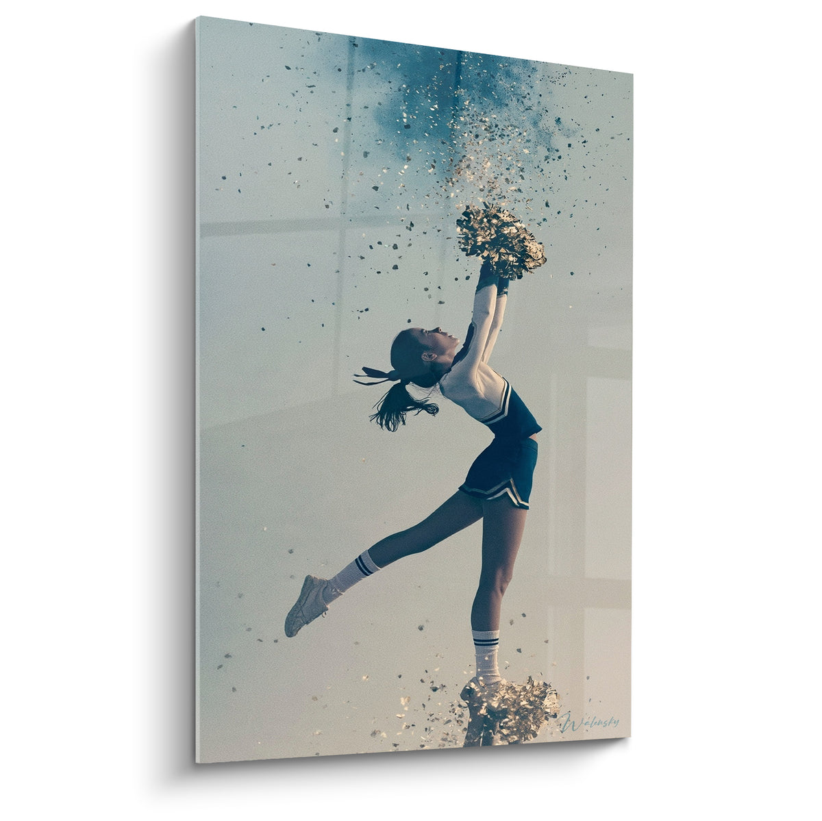 Wall art of a cheerleader arched back in a navy blue uniform, golden pom-poms raised, confetti scattered through the air