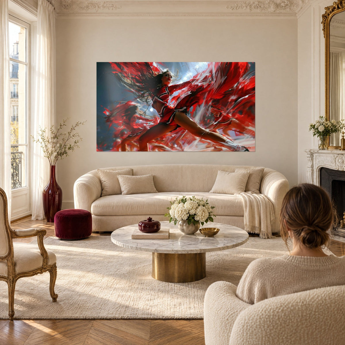 Wall art cheerleader in a full split, red skirt with white trim, hair flying, above a sofa in a bright living room