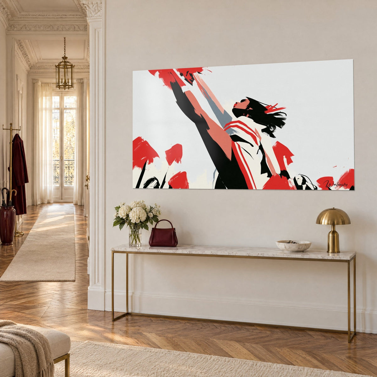Wall art of a cheerleader with chin raised, scarlet pom-poms and a cream striped outfit, hung above a gilded Haussmann console