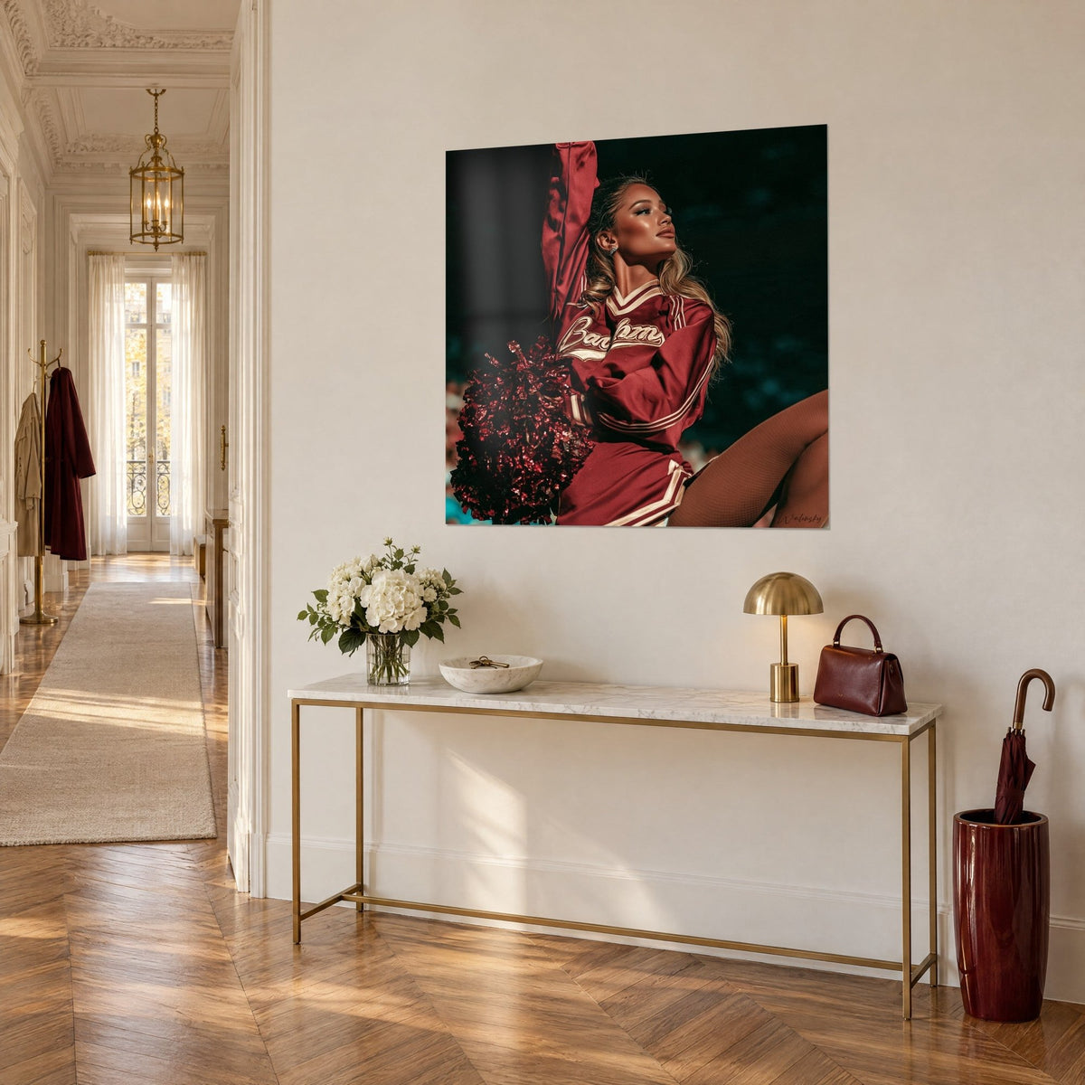 Wall art cheerleader with a sideways glance, burgundy-red bodysuit with gold lettering and amber fishnet tights, on a gold console in three-quarter view