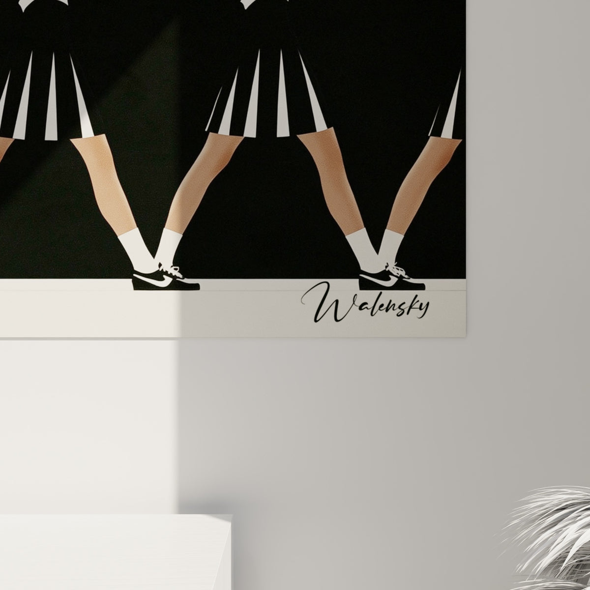 Grain de l'impression sur les jupes plissées noires et blanches et les pompons rouges de l'œuvre Cheerleader