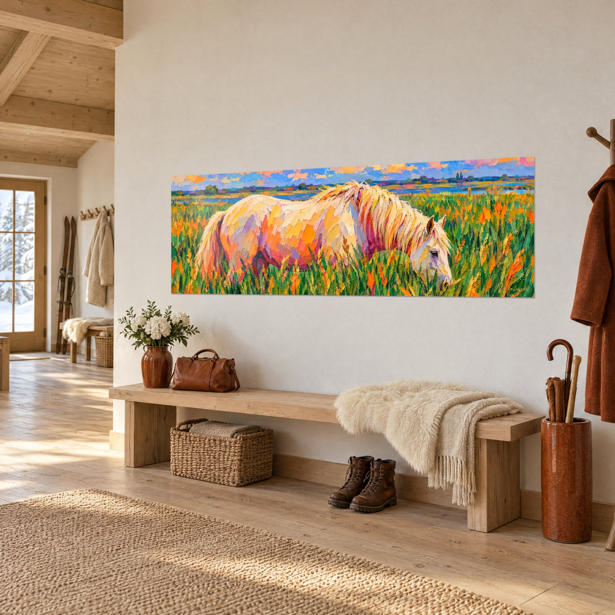 Tableau camarguais à la robe crème et rose paissant dans les herbes vertes et orangées, sur mur blanc d'un chalet