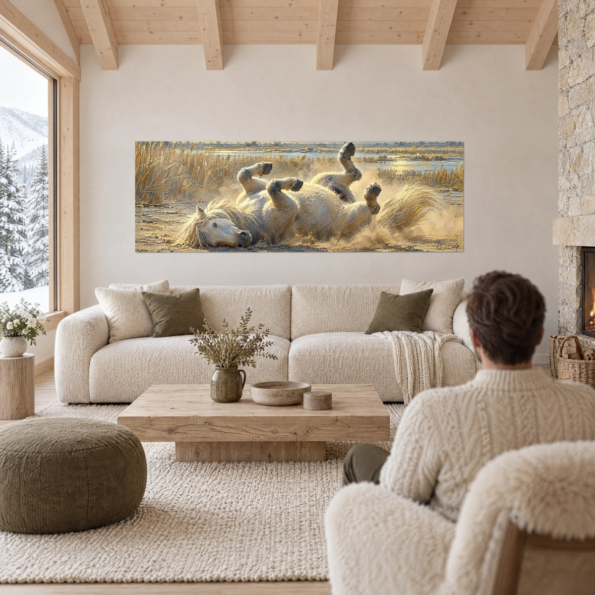 Tableau cheval camargue blanc roulant sur le dos, sabots levés, crinière ivoire et herbes dorées, au-dessus d'un canapé dans un salon lumineux