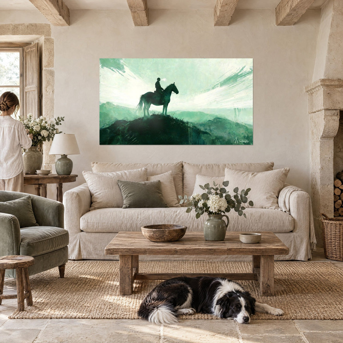 Wall art silhouette of a rider on horseback in dark outline, emerald green and misty white, above a sofa in a bright living room