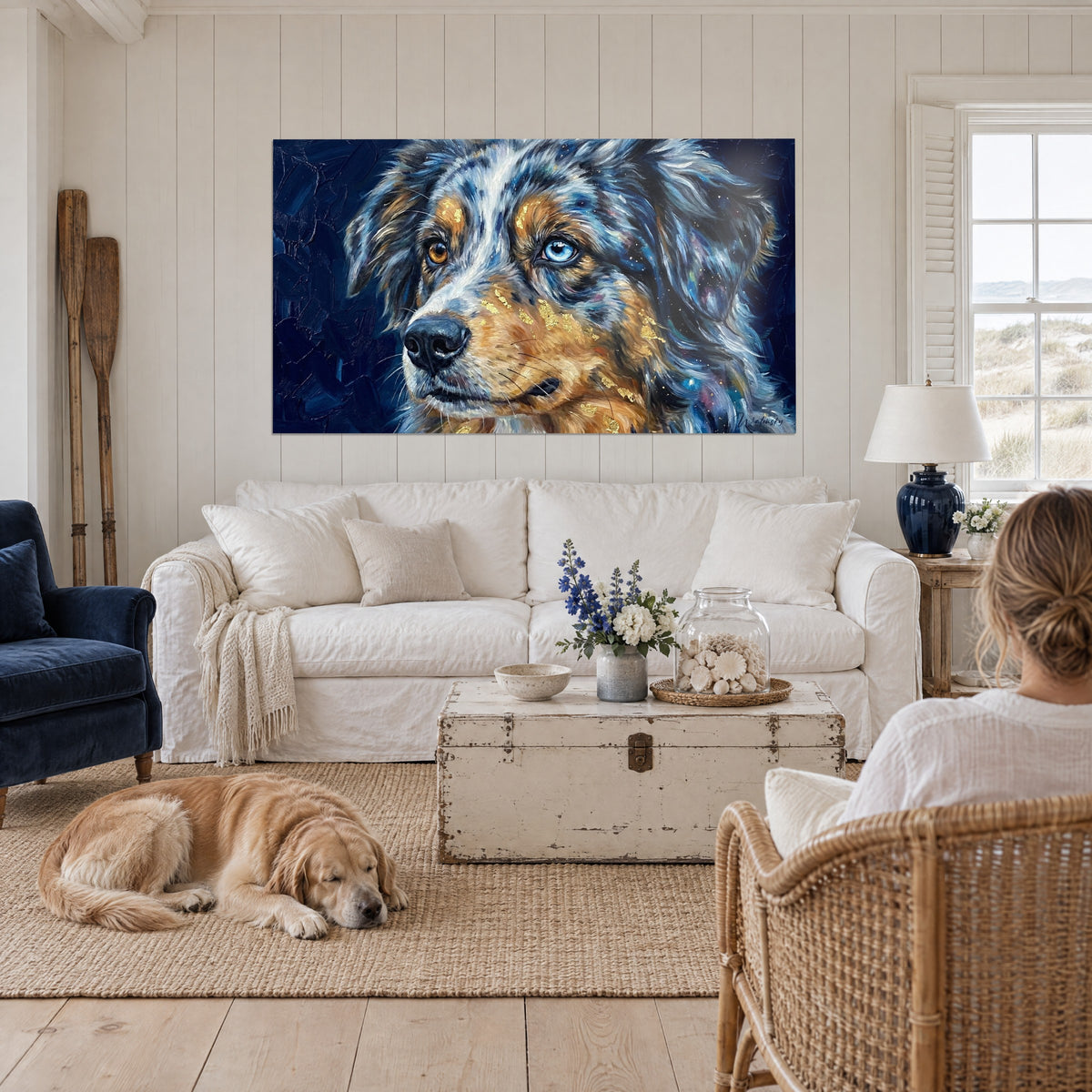 Wall art miniature American shepherd with odd eyes, blue merle coat and golden sparkles, above a sofa in a bright living room