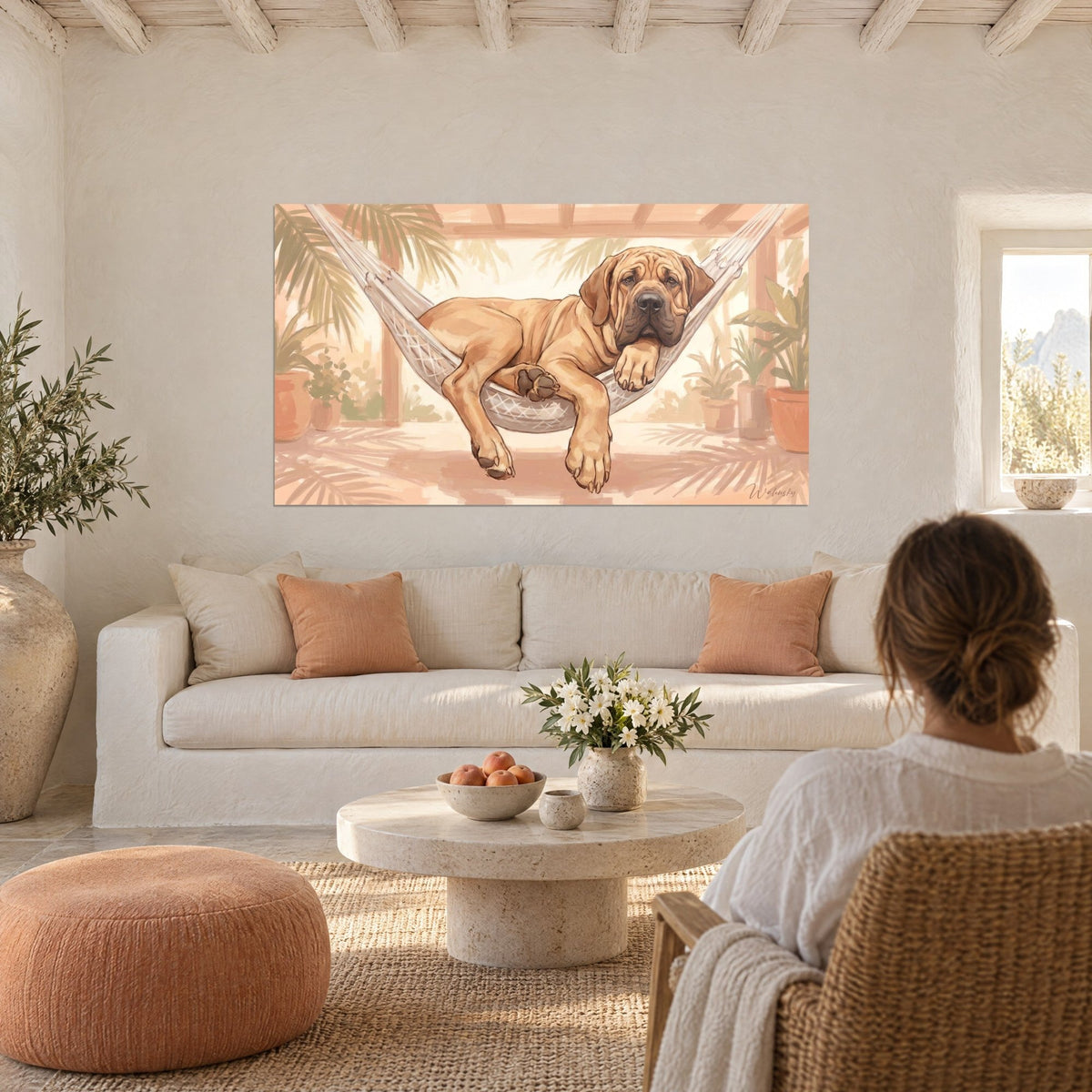Wall art tawny Fila Brasileiro lying in a white hammock, black muzzle and golden folds, peach background, above a sofa in a bright living room
