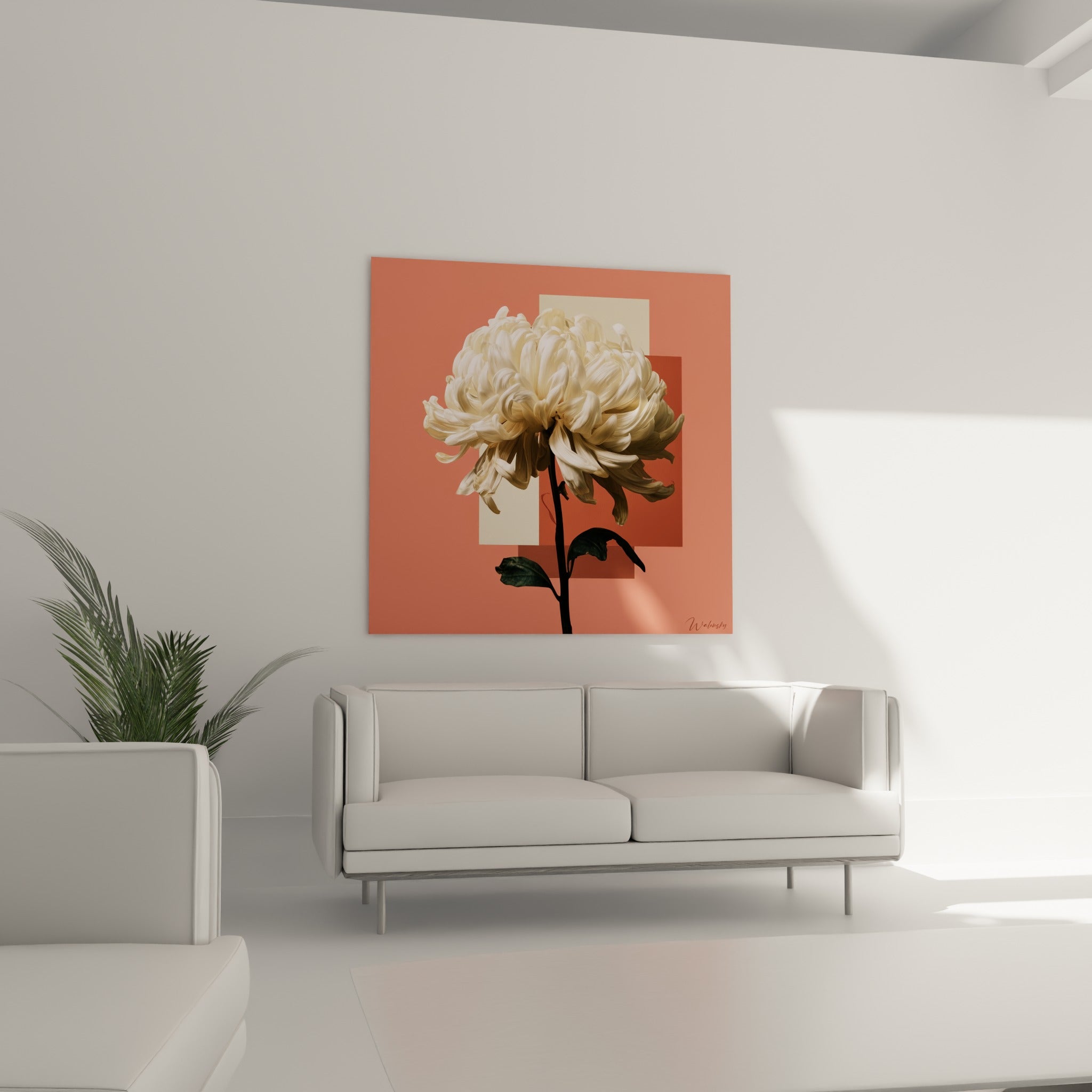 Chrysanthème aux tons ivoire et corail suspendu au-dessus d'un canapé dans un salon lumineux