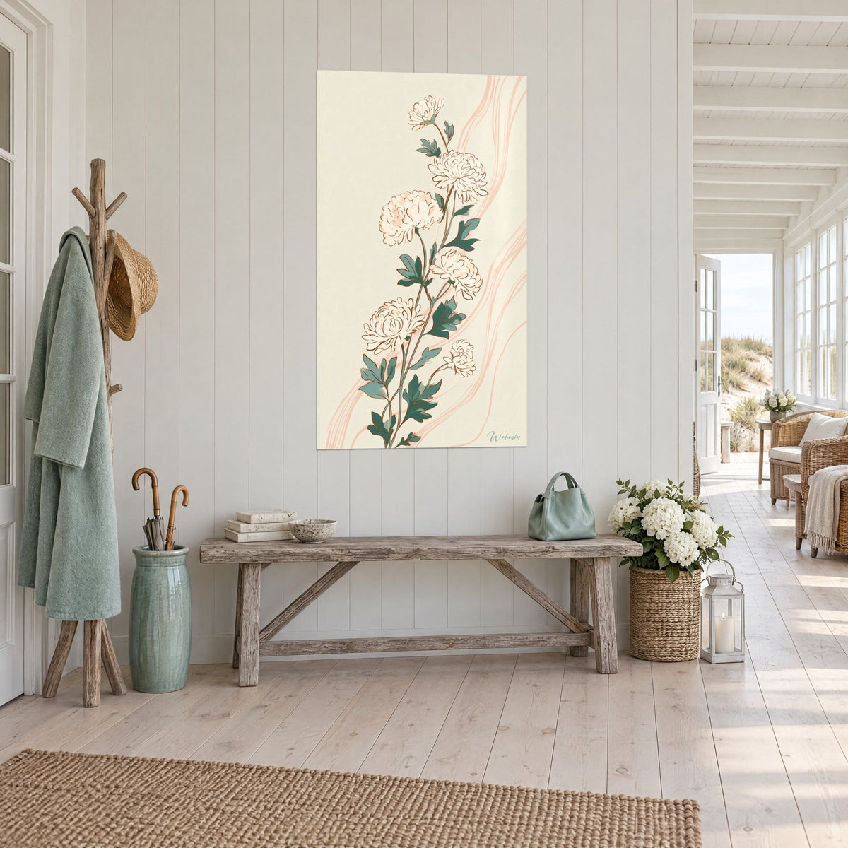 Wall art flowering stem with ivory pompons outlined in brown, sage-green foliage, pale pink ribbon, entryway with light wood and seaside