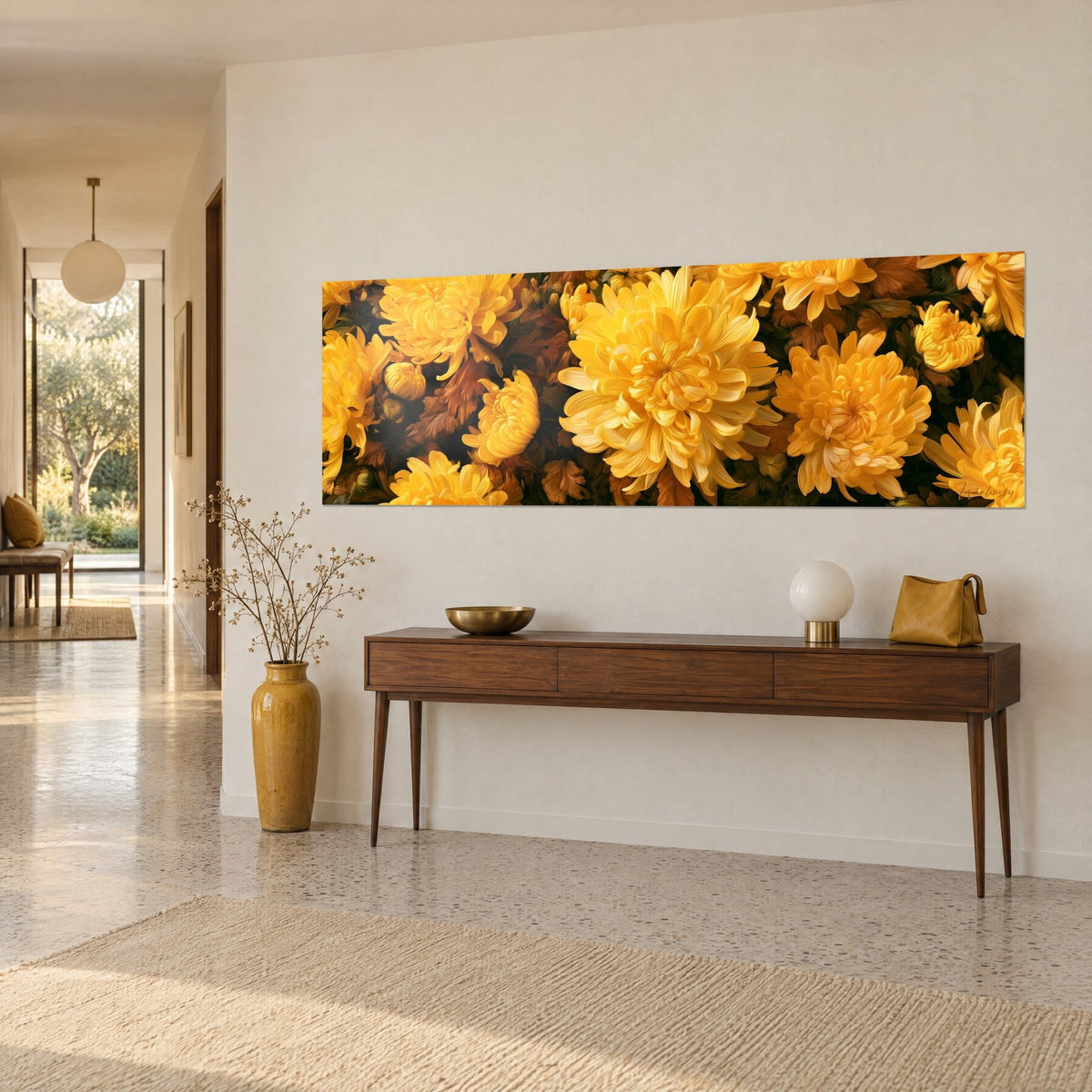 Horizontal floral wall art with golden petals and copper-toned foliage on a cream wall, three-quarter view above a console table