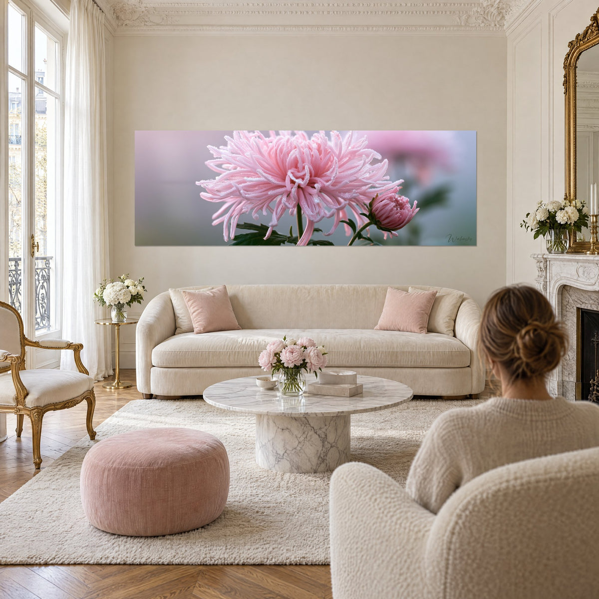 Wall art powdery pink chrysanthemum with slender petals beaded with dew, blurred grey-green background, above a sofa in a bright living room