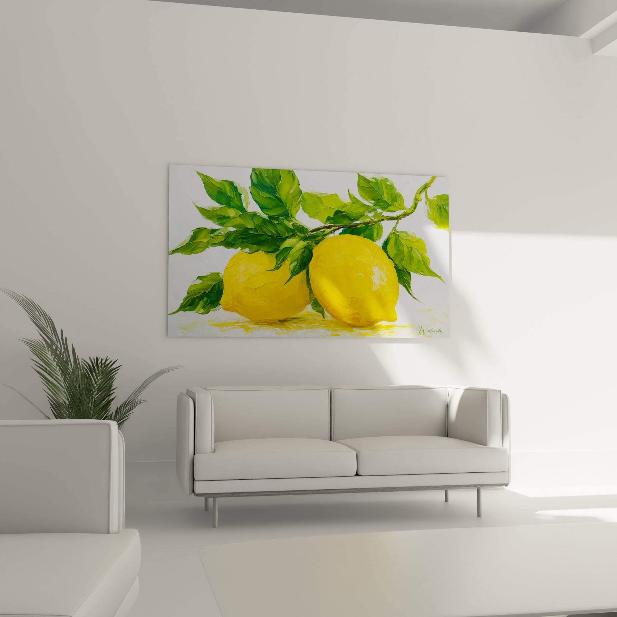Branche de citrons jaunes et verts placée au-dessus d'un canapé dans un salon lumineux et épuré