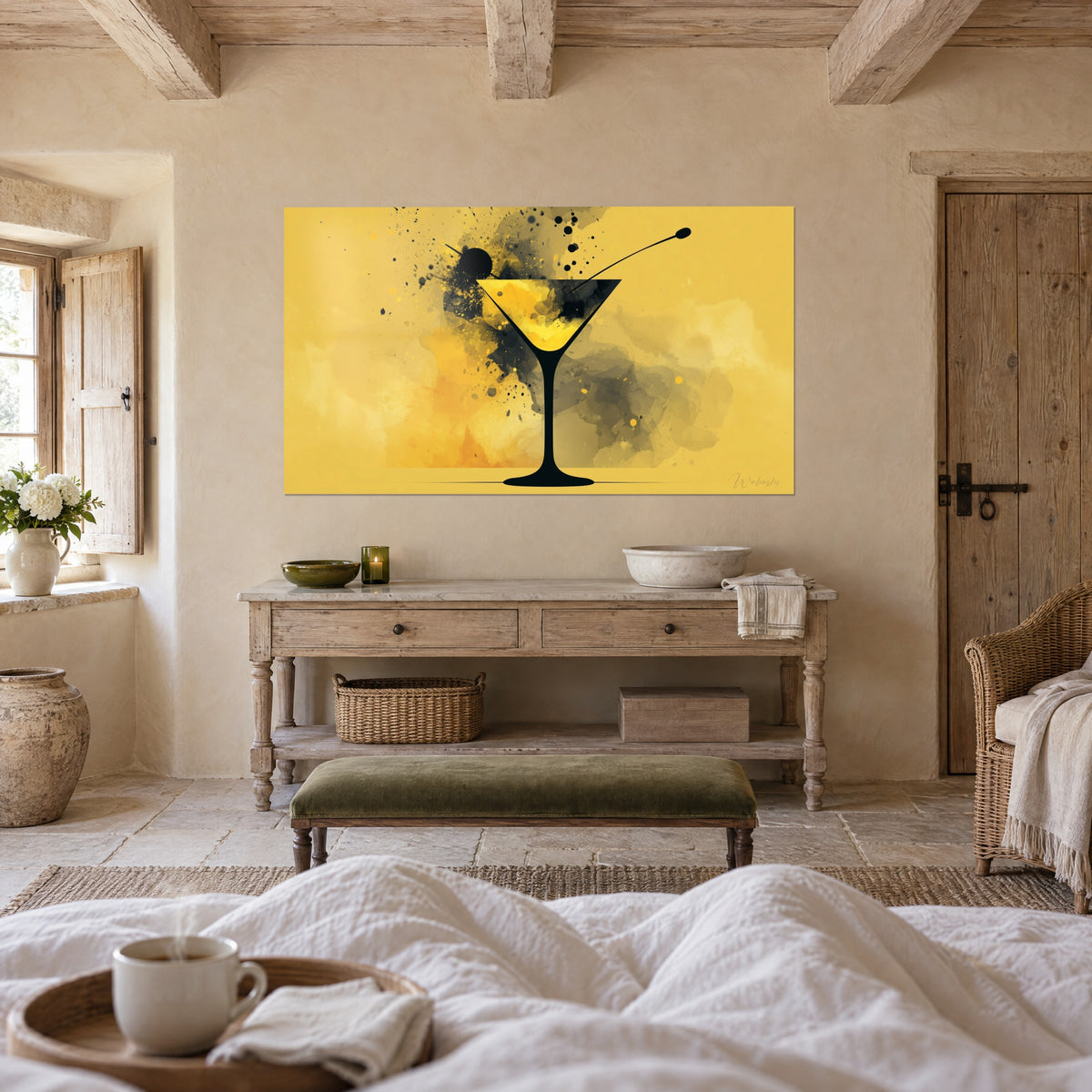 Wall art stylised cocktail, slender black stem on mustard yellow background speckled with grey, whitewashed wall above a bed in a light bedroom