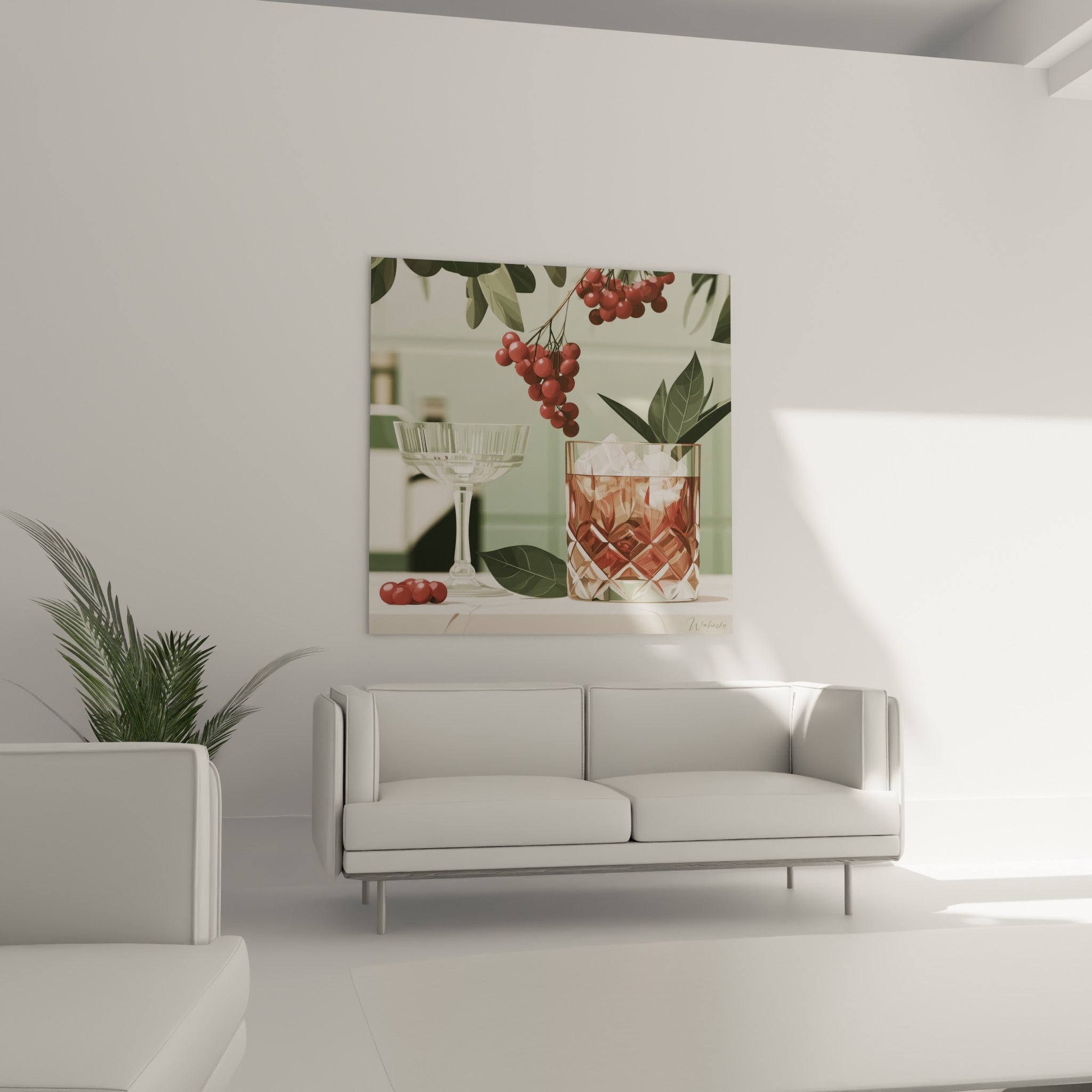 Composition cocktail terracotta et feuilles vertes accrochée au-dessus d'un canapé dans un salon lumineux