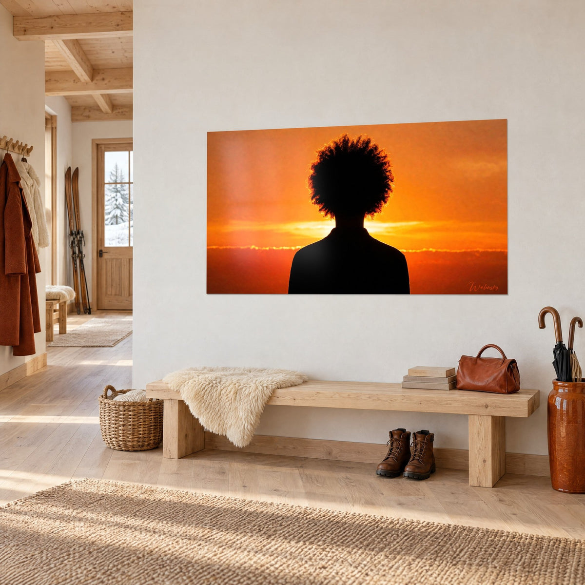 Wall art rear profile with curls sculpted by a golden halo, amber and rust background, on a white chalet-style entrance wall