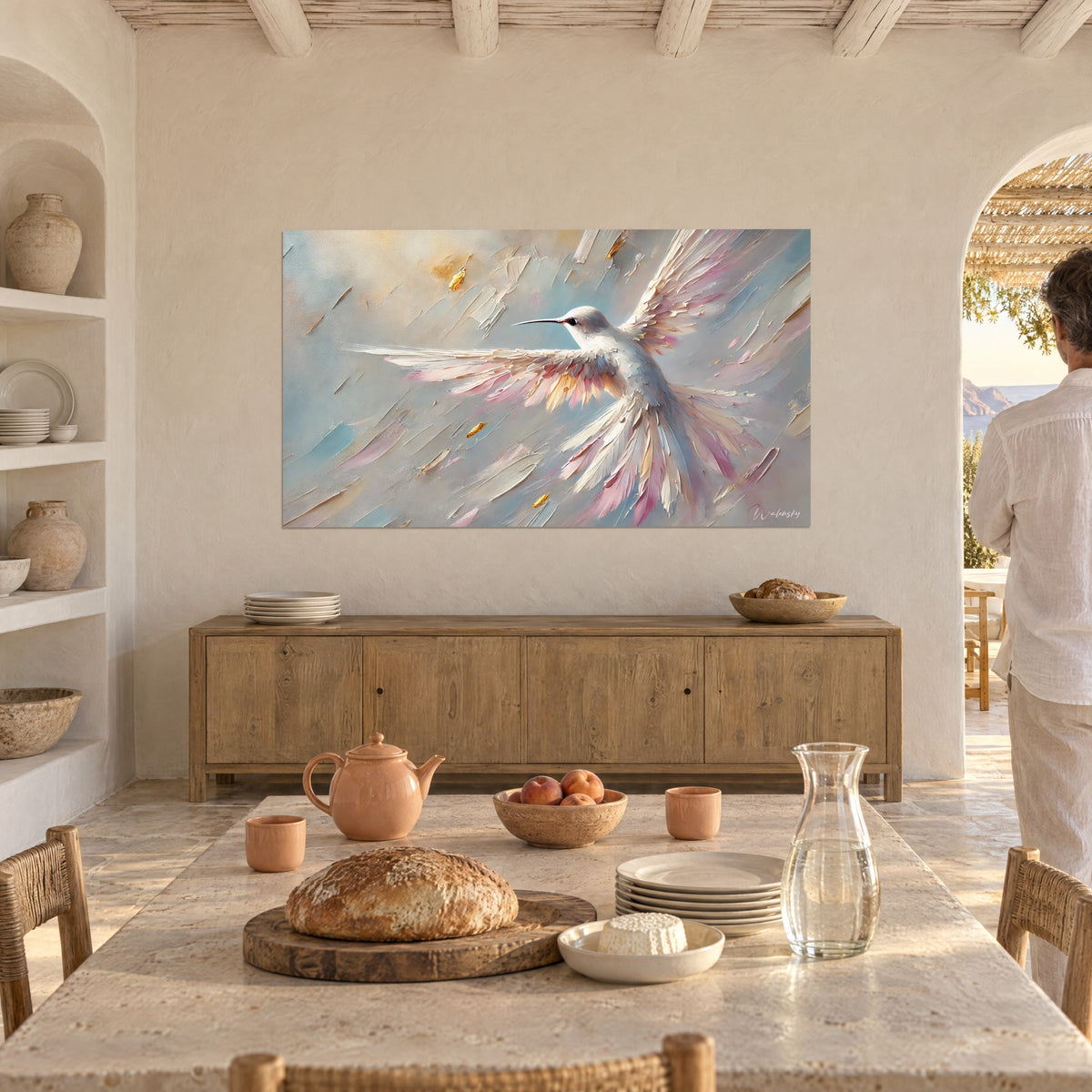 Wall art ivory hummingbird in flight, raised pink and gold feathers, powder blue, beige wall of a Mediterranean dining room