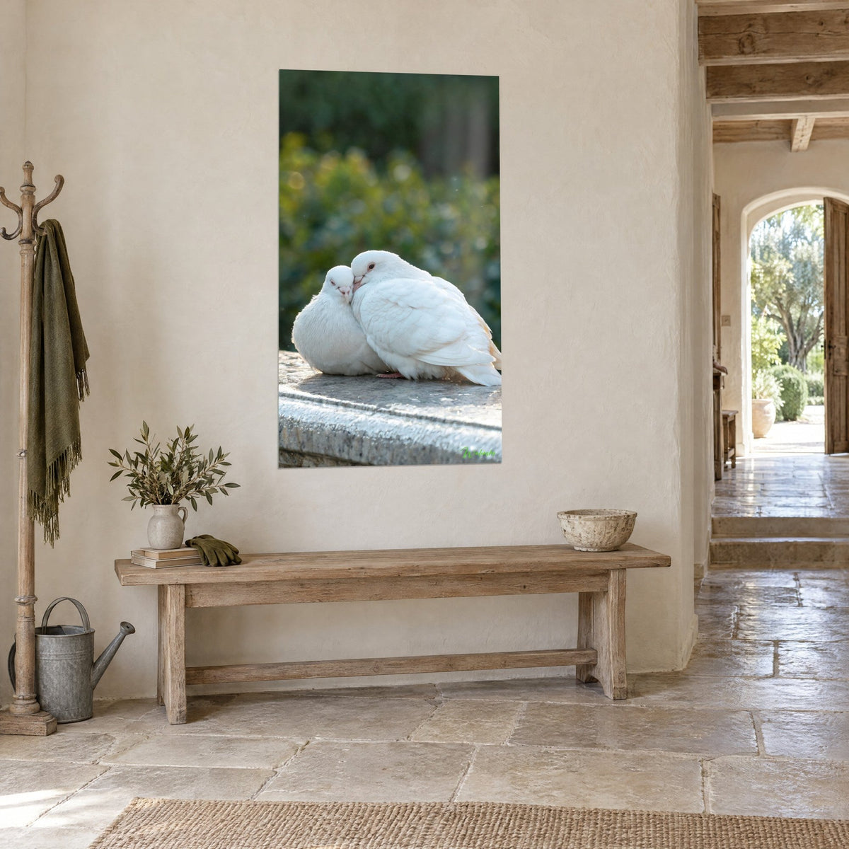 Wall art two ivory turtle doves in a tender embrace, gentle beak resting against the cheek, grey stone and green foliage, three-quarter view