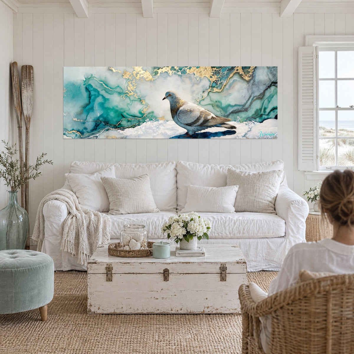 Wall art grey dove with golden highlights on turquoise marble, two people seen from behind, above a sofa in a bright living room