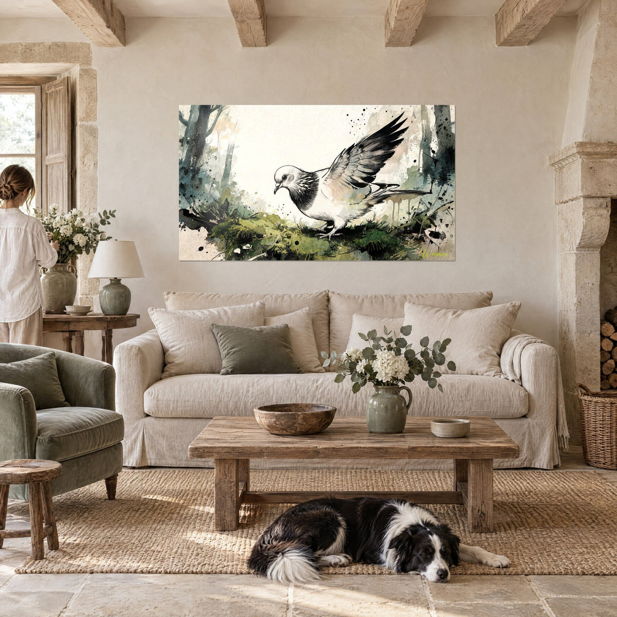 Wall art white dove with spread grey wings, green moss and black ink, above a sofa in a bright living room