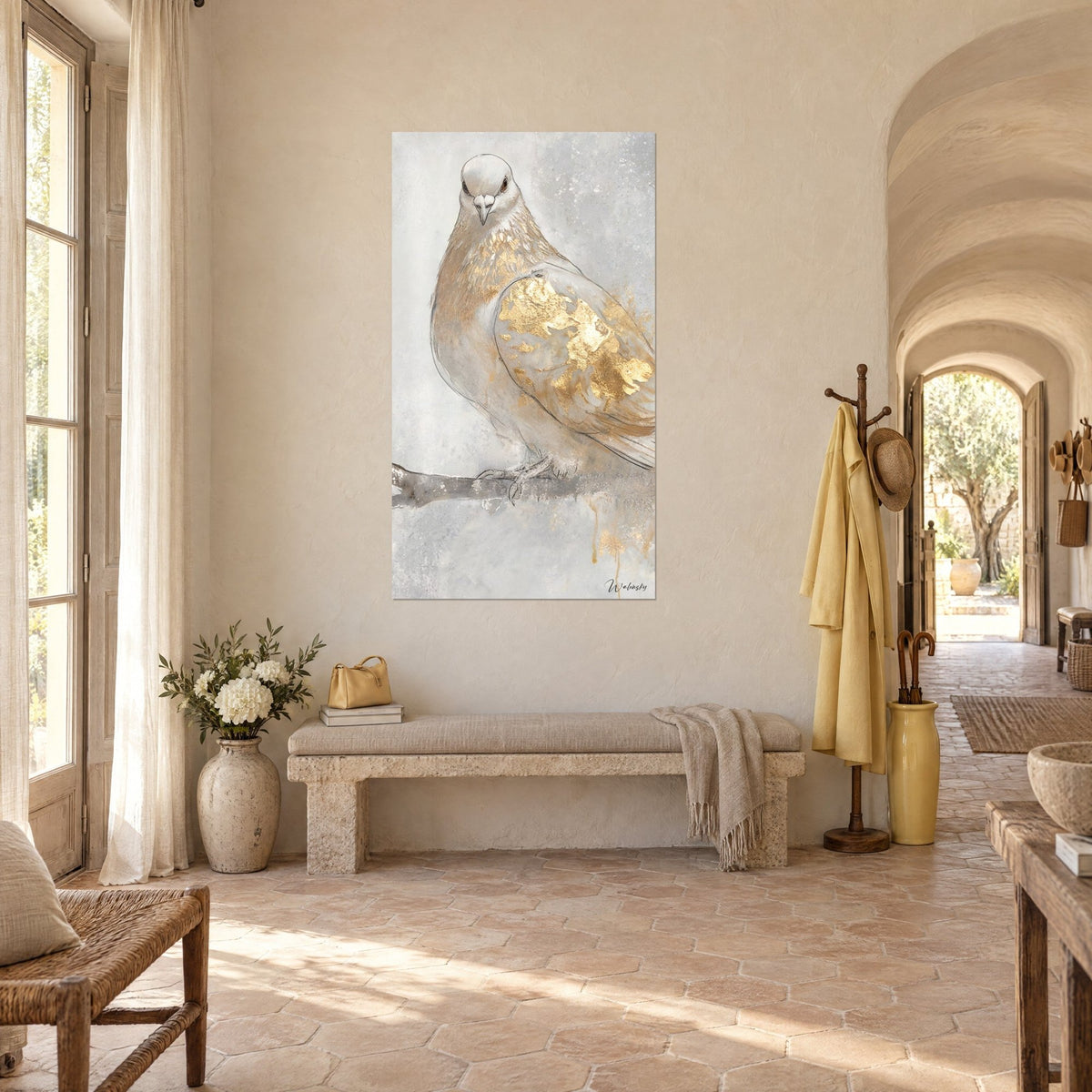 Wall art bird with a pearl-grey belly and a wing covered in gold leaf, three-quarter view in the entrance of a Provençal farmhouse
