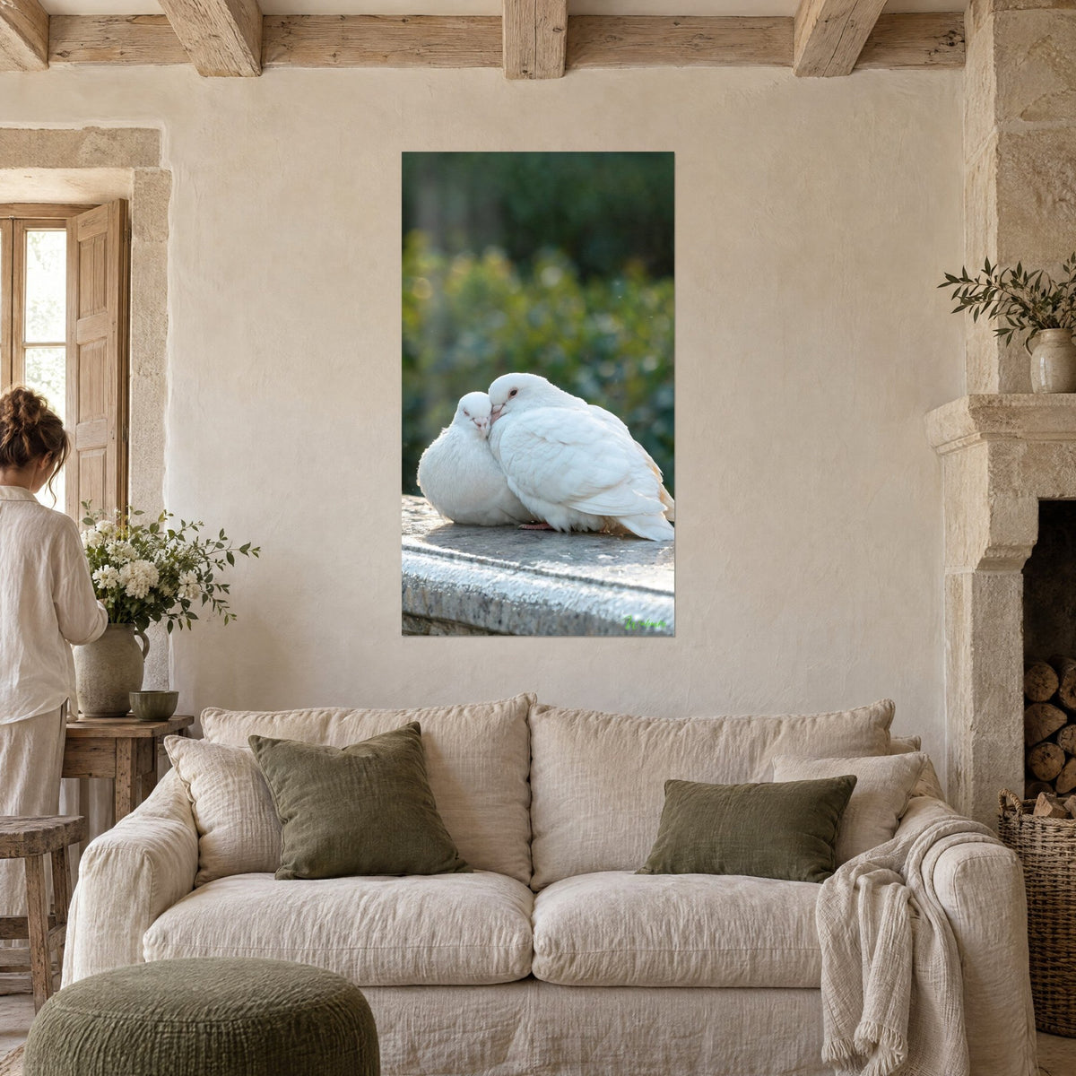 Wall art white doves nestled together, cream plumage on grey stone, soft blurred green background, above a sofa in a bright living room