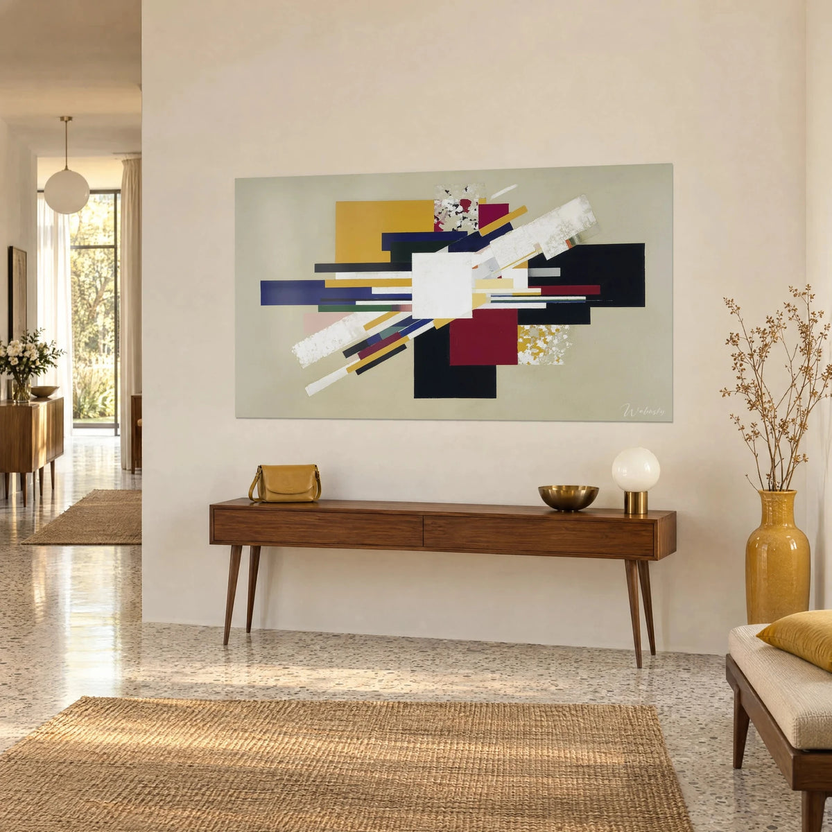 Wall art constructivist piece with mustard and black rectangles, central white square, cream diagonals on a beige background, above a wooden console
