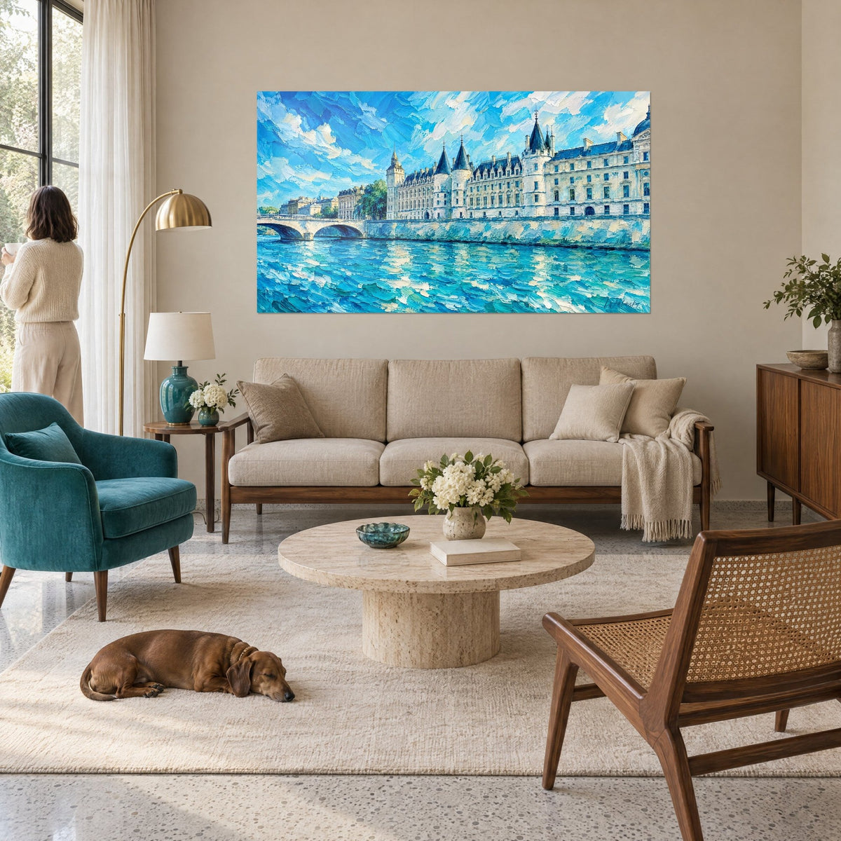 Wall art medieval castle with slate-blue turrets, turquoise Seine and blue sky, woman and dachshund, above a sofa in a bright living room