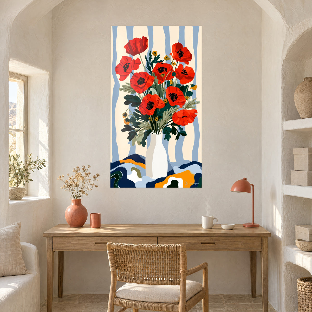 Wall art rustic bouquet in red and fir green, wavy navy and ochre tablecloth, above a light wood desk
