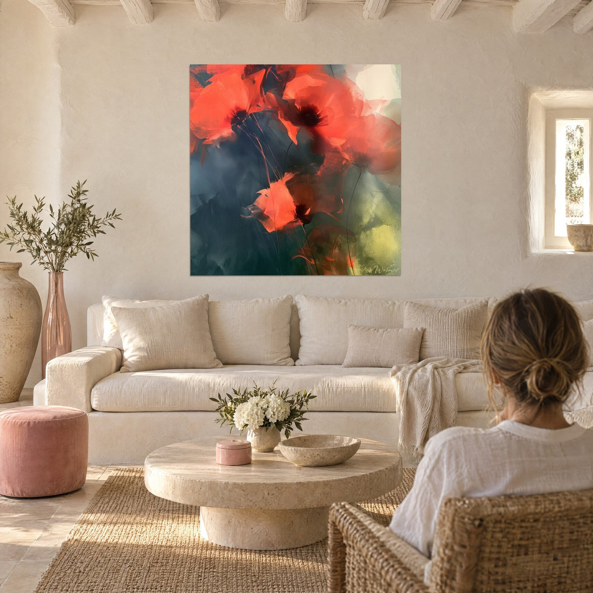 Wall art scarlet poppies with black hearts on a midnight blue background, slender stems and a yellow-green veil, above a sofa in a bright living room